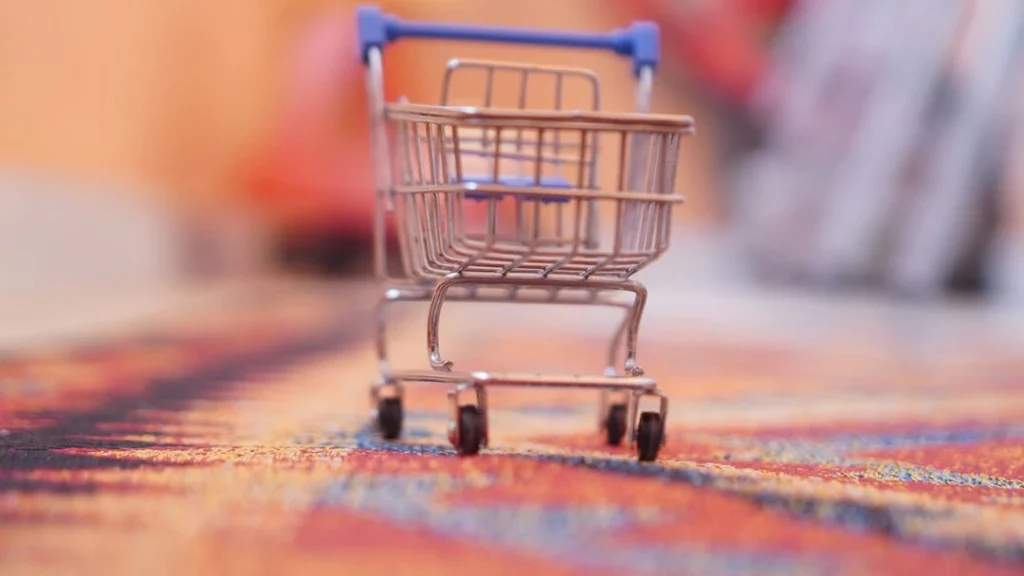 Icono de carrito de compras digital, símbolo de comercio electrónico y compras online.