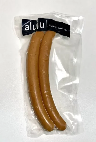 Pack de frankfurts cocidos Aluju, envasados al vacío, con etiqueta visible y presentación lista para consumir.