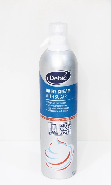Crema láctea con azúcar Debic: nata montada profesional para postres Envase de crema láctea con azúcar Debic de 700 ml, con etiqueta azul y detalles multilingües, ideal para repostería profesional.